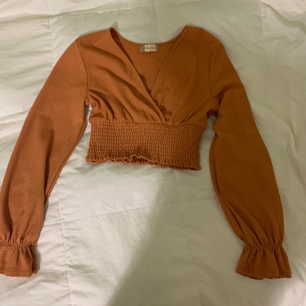 Cropped long sleeve orange top